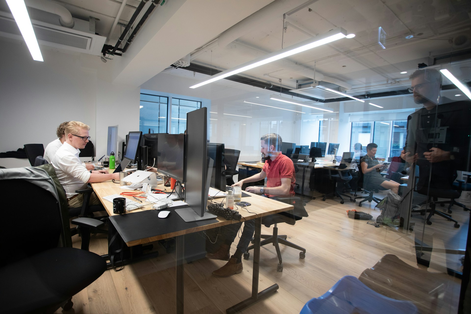 Tech Global Agency team working together in the office